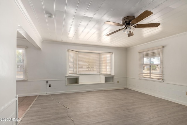 813 N Gilbert Ave, Casa Grande, AZ 85122 - spare room featuring baseboards, ornamental molding, a ceiling fan, and wood finished floors
