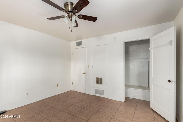 813 N Gilbert Ave, Casa Grande, AZ 85122 - unfurnished bedroom with visible vents, light tile patterned floors, and a closet