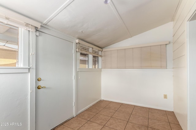 813 N Gilbert Ave, Casa Grande, AZ 85122 - spare room featuring tile patterned floors and lofted ceiling