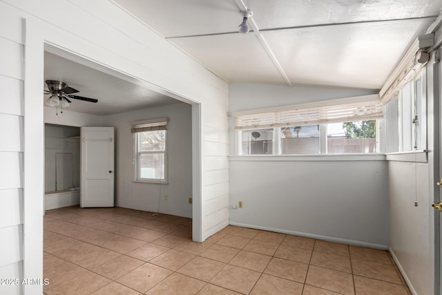 813 N Gilbert Ave, Casa Grande, AZ 85122 - unfurnished room featuring light tile patterned floors, baseboards, a ceiling fan, and vaulted ceiling
