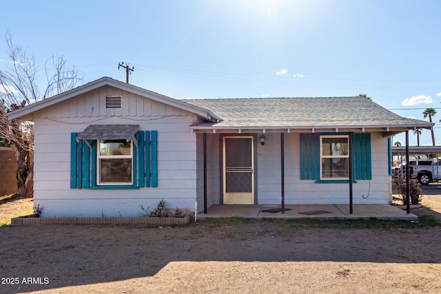 813 N Gilbert Ave, Casa Grande, AZ 85122 - ranch-style home featuring covered porch, roof with shingles, and a carport