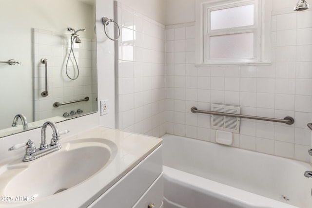813 N Gilbert Ave, Casa Grande, AZ 85122 - bathroom with visible vents, shower / bathing tub combination, and vanity