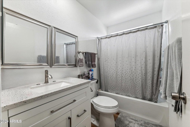 full bathroom featuring vanity, shower / tub combo, and toilet