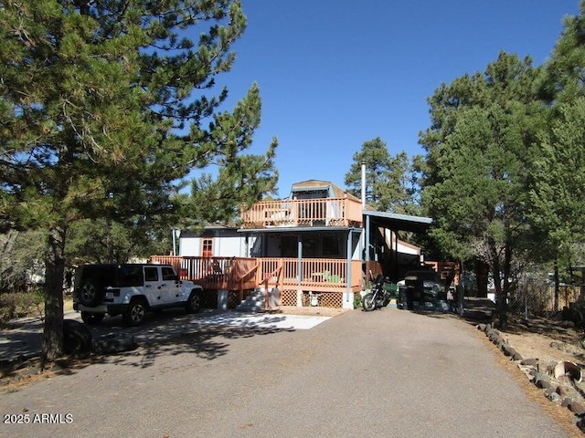 view of front facade featuring a wooden deck