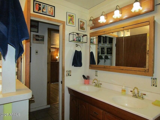 bathroom with tile patterned flooring, double vanity, and a sink