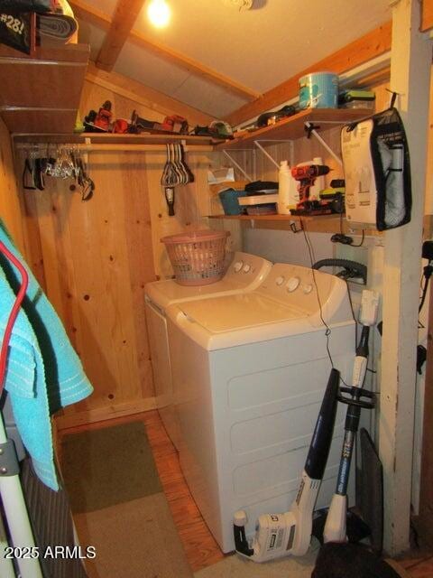 clothes washing area with laundry area and washer and clothes dryer