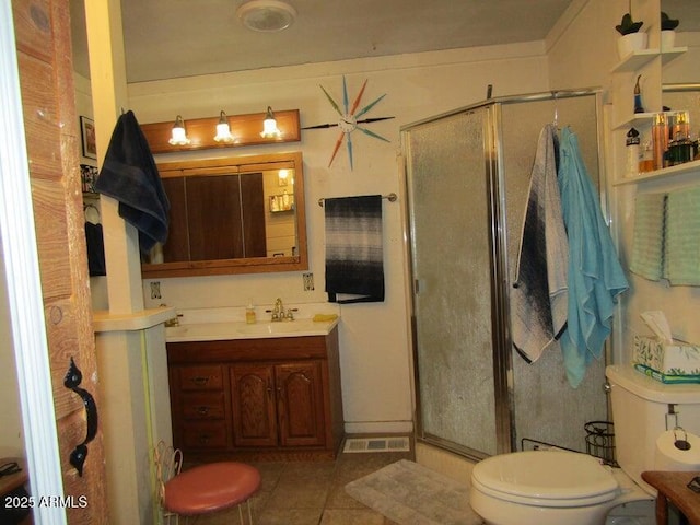 full bath with tile patterned floors, a stall shower, toilet, and vanity