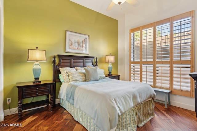 bedroom with dark hardwood / wood-style floors