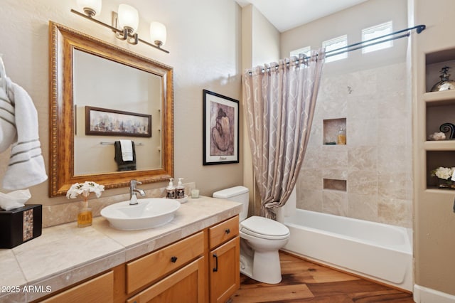 full bathroom featuring shower / bath combination with curtain, vanity, toilet, and hardwood / wood-style flooring