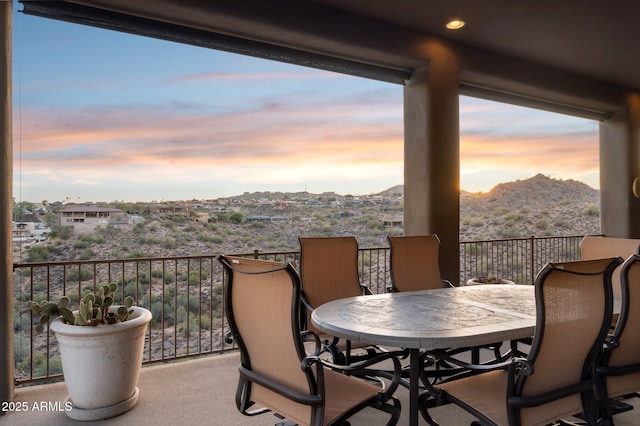 balcony at dusk with a mountain view