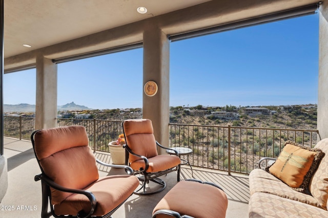 sunroom with a mountain view