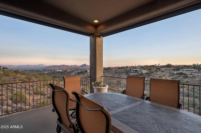 view of patio terrace at dusk