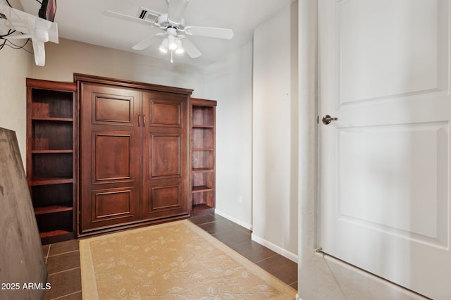 tiled foyer entrance with ceiling fan