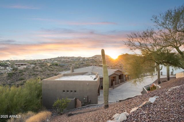 view of property exterior at dusk