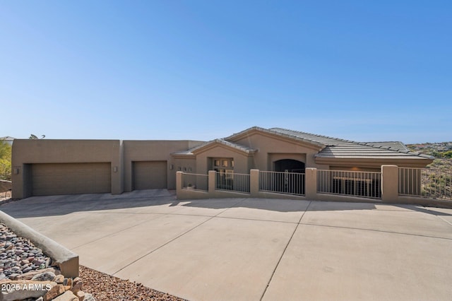 view of front of property with a garage