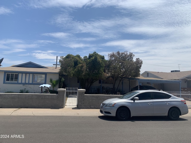 5833 W Rosewood Ln, Phoenix, AZ 85031 - view of front of home featuring a fenced front yard and a gate