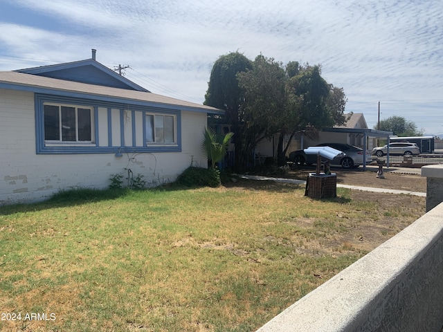 5833 W Rosewood Ln, Phoenix, AZ 85031 - view of side of property featuring a lawn