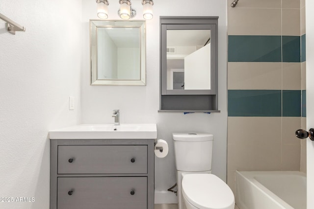 bathroom with toilet, visible vents, and vanity