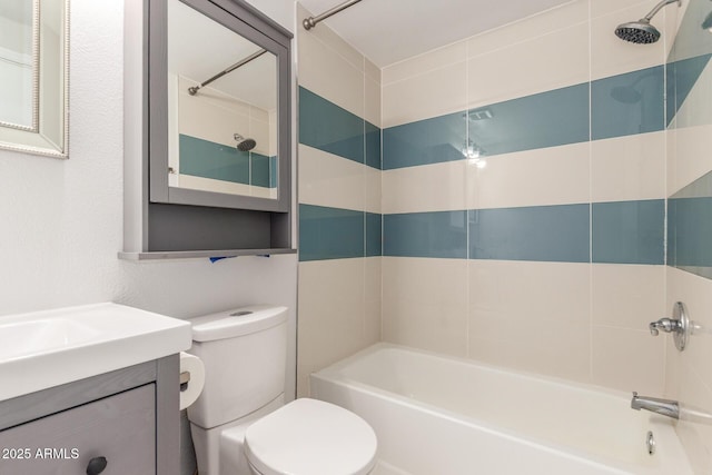 bathroom with vanity, shower / tub combination, and toilet