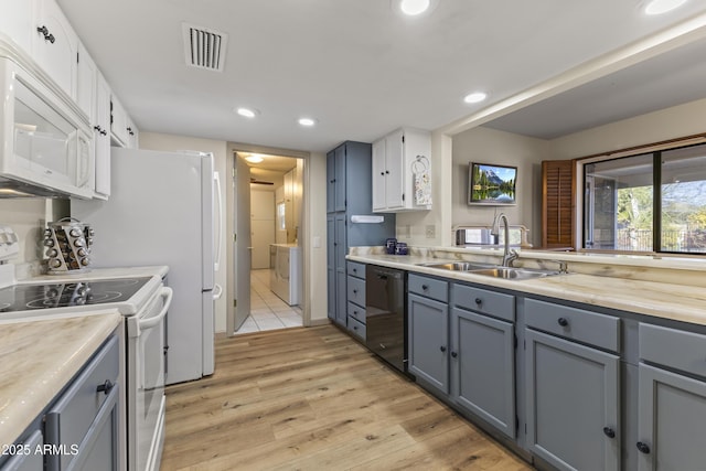 kitchen with sink, white appliances, gray cabinetry, light hardwood / wood-style floors, and white cabinets