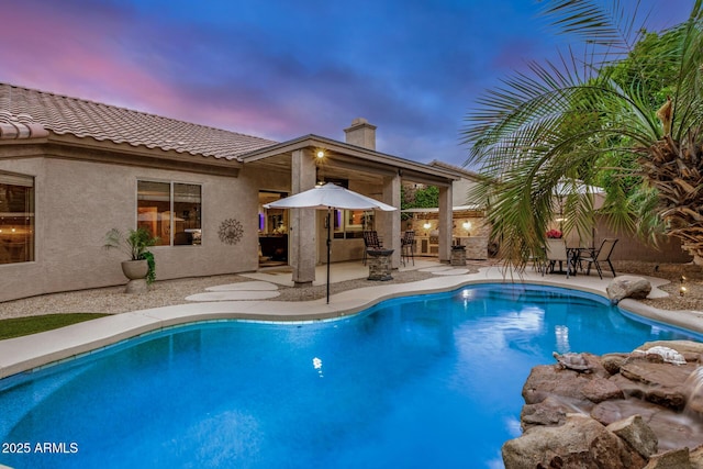 view of pool with a fenced in pool and a patio