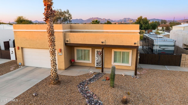 view of front of house featuring a mountain view and a patio area