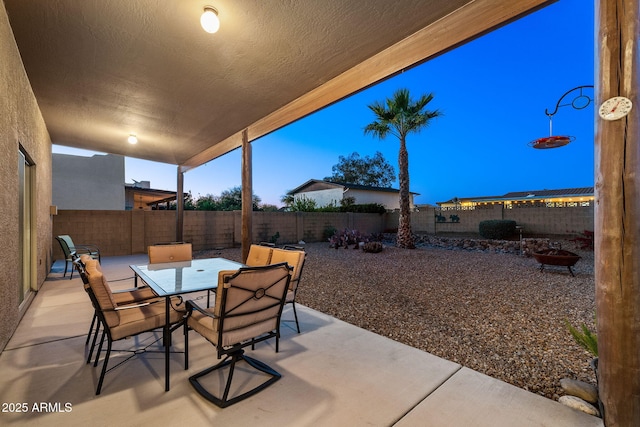 view of patio terrace at dusk