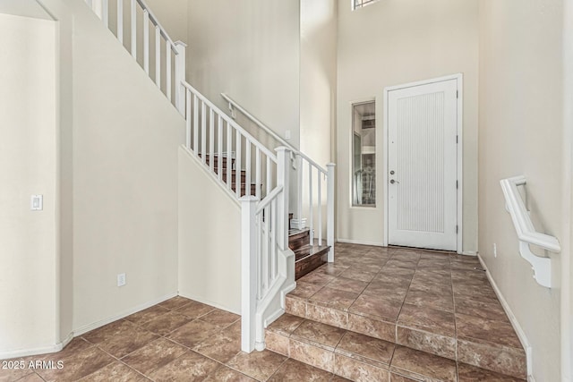 4507 E Lantern Pl, Gilbert, AZ 85297 - foyer entrance with stairway, a towering ceiling, and baseboards