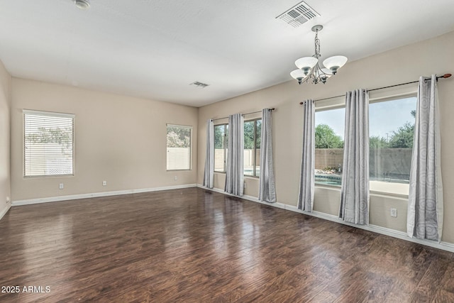 4507 E Lantern Pl, Gilbert, AZ 85297 - spare room with a chandelier, wood finished floors, plenty of natural light, and baseboards