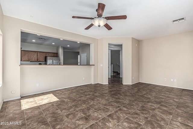 4507 E Lantern Pl, Gilbert, AZ 85297 - unfurnished living room featuring ceiling fan and baseboards