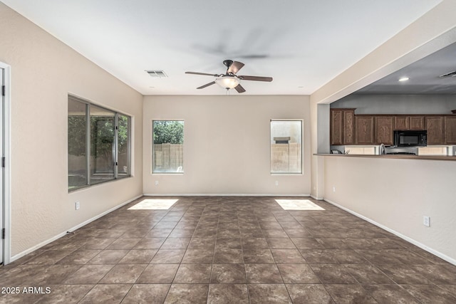 4507 E Lantern Pl, Gilbert, AZ 85297 - unfurnished living room featuring a ceiling fan and baseboards