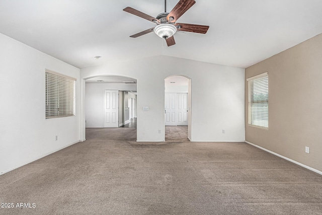 4507 E Lantern Pl, Gilbert, AZ 85297 - unfurnished living room featuring arched walkways, a ceiling fan, carpet flooring, baseboards, and vaulted ceiling