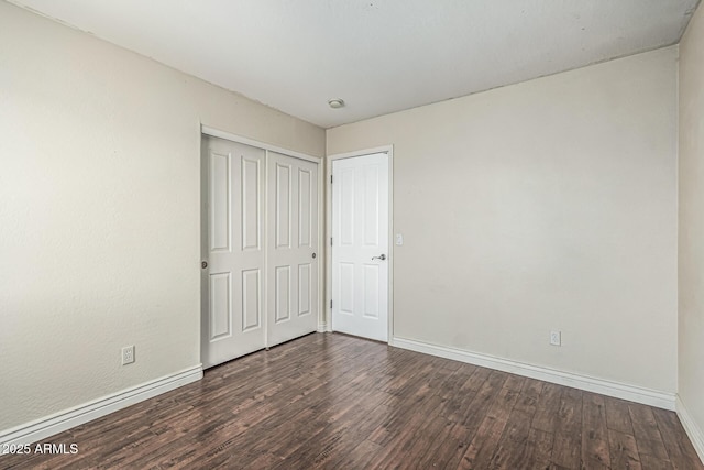 4507 E Lantern Pl, Gilbert, AZ 85297 - unfurnished bedroom featuring baseboards, wood finished floors, and a closet