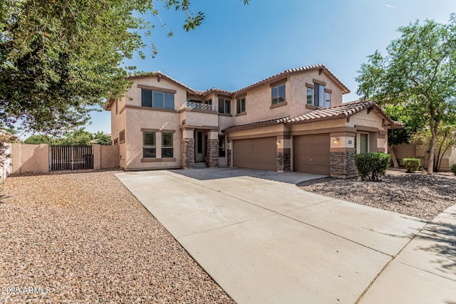 4507 E Lantern Pl, Gilbert, AZ 85297 - mediterranean / spanish-style house with a gate, driveway, stucco siding, stone siding, and a tile roof
