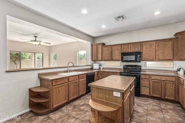 4507 E Lantern Pl, Gilbert, AZ 85297 - kitchen featuring black appliances, a sink, open shelves, brown cabinetry, and recessed lighting