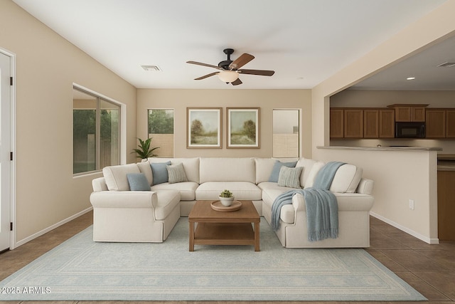 4507 E Lantern Pl, Gilbert, AZ 85297 - living area featuring a ceiling fan, dark tile patterned flooring, and baseboards