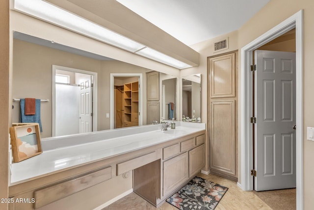 bathroom with visible vents and vanity