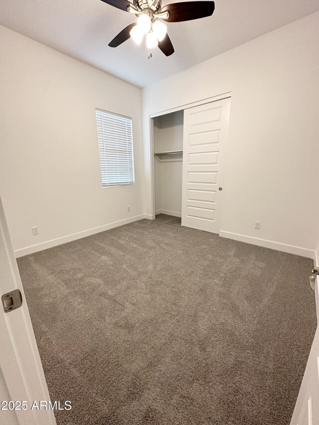 5923 N 85th Ave, Glendale, AZ 85305 - unfurnished bedroom featuring baseboards, dark carpet, and a closet