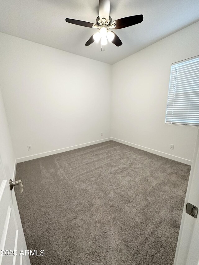 5923 N 85th Ave, Glendale, AZ 85305 - empty room with baseboards, ceiling fan, and dark colored carpet