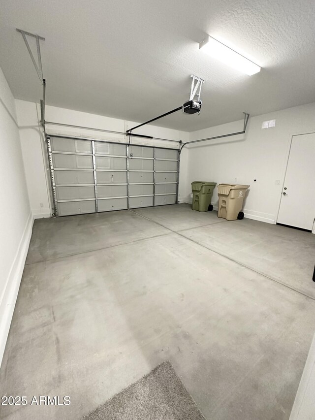 5923 N 85th Ave, Glendale, AZ 85305 - garage with baseboards and a garage door opener
