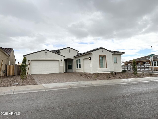 5923 N 85th Ave, Glendale, AZ 85305 - single story home with a tiled roof, driveway, fence, an attached garage, and stucco siding