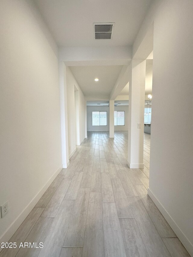 5923 N 85th Ave, Glendale, AZ 85305 - hallway featuring baseboards, visible vents, and light wood-style flooring