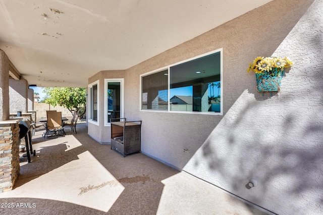 view of patio / terrace featuring outdoor dining area and fence