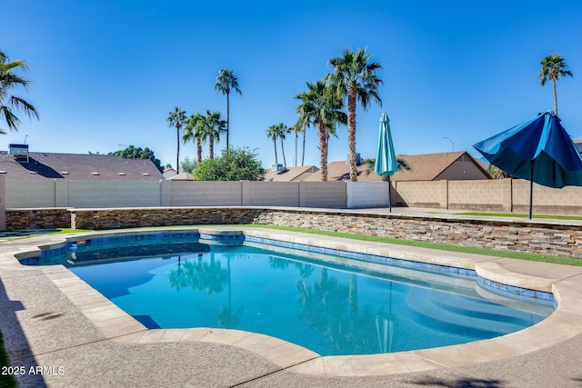 view of swimming pool featuring a fenced backyard and a fenced in pool