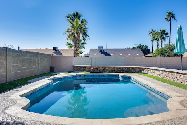 view of swimming pool with a fenced backyard and a fenced in pool