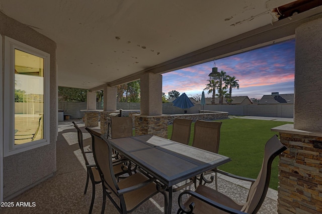 view of patio featuring outdoor dining space and a fenced backyard