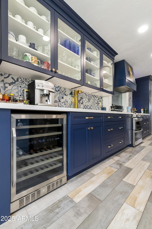 1656 W Meseto Cir, Mesa, AZ 85202 - indoor dry bar featuring wine cooler, custom range hood, and decorative backsplash