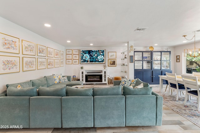 1656 W Meseto Cir, Mesa, AZ 85202 - living room with recessed lighting, wood finished floors, and a glass covered fireplace