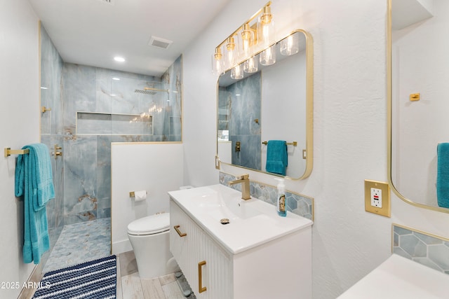 1656 W Meseto Cir, Mesa, AZ 85202 - bathroom with a marble finish shower, toilet, vanity, and recessed lighting
