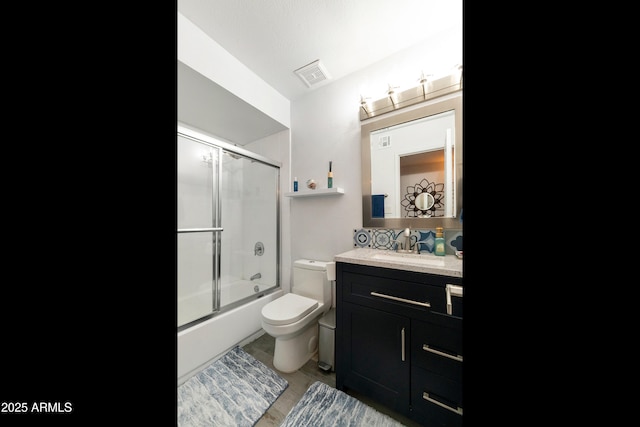 1656 W Meseto Cir, Mesa, AZ 85202 - bathroom featuring toilet, vanity, and bath / shower combo with glass door
